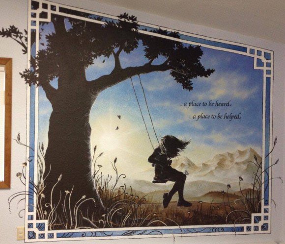 Alaskan artist Jamie Bottoms Held By Hope child advocacy wall mural